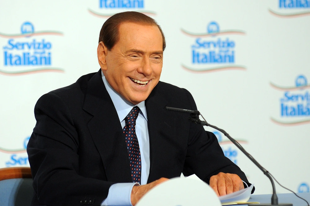 Silvio Berlusconi - happy while he was still alive and the owner of AC Milan