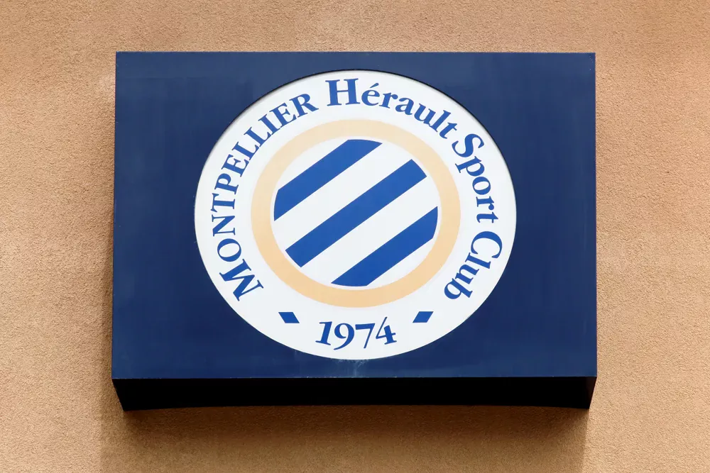 Montpellier logo displayed on a wall